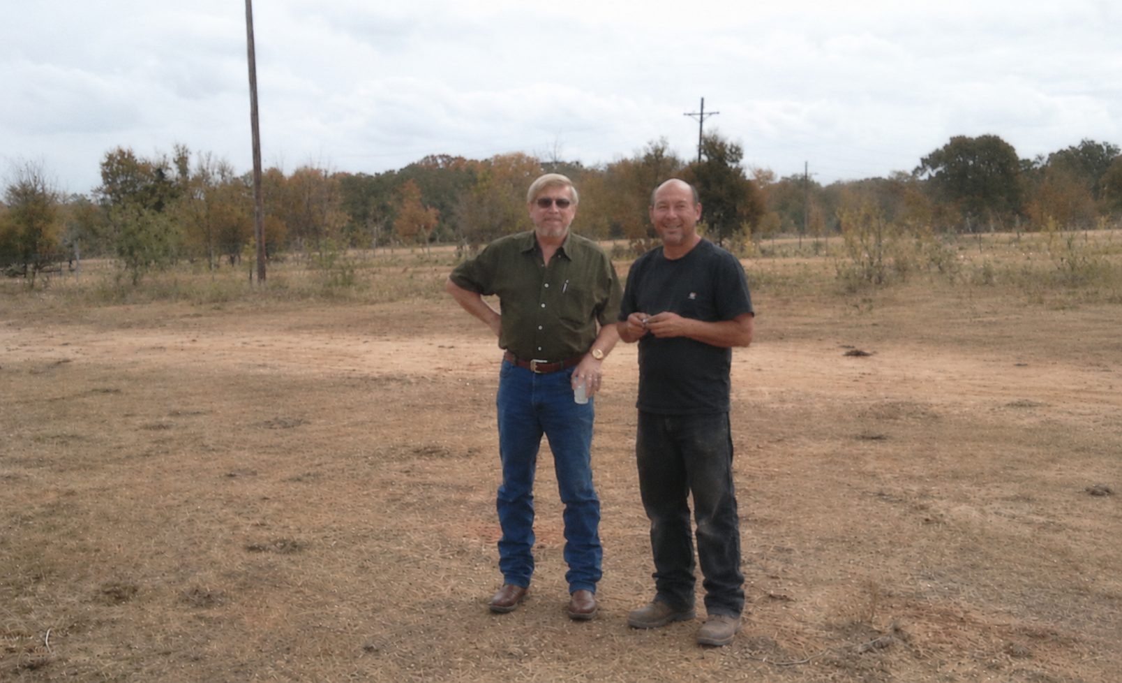 Mike Rhodes and Carol Discher on a cleared building site